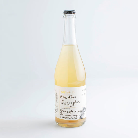 Bottle of Gosnells Eucalyptus mead with a small honey sample jar.